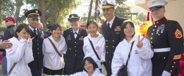Japanese exchange students pose with United States military personnel.