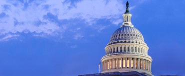 Dome of US Capitol building against blue sky