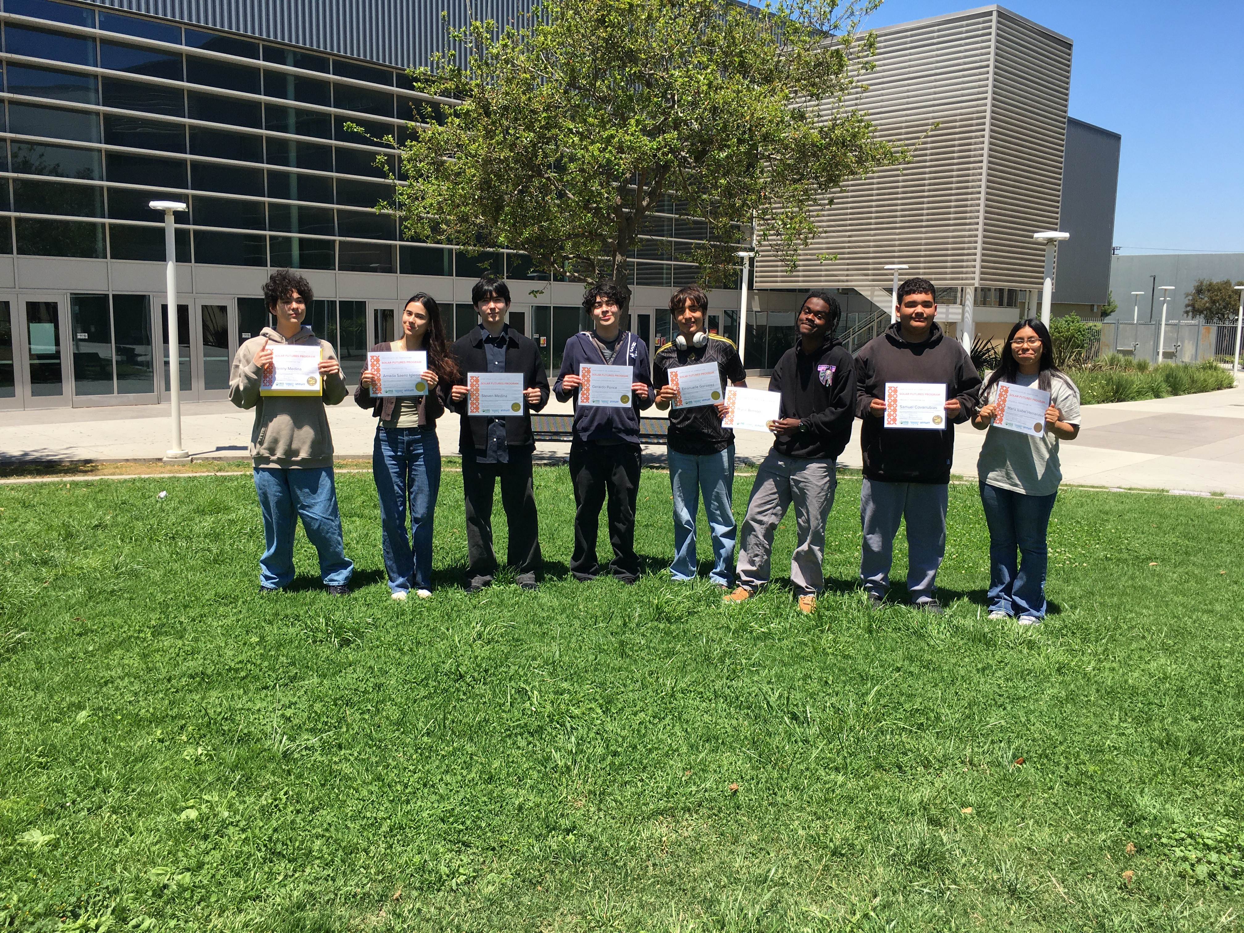 Students holding certificates